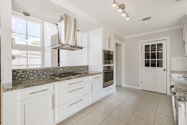 1326 Forest Home Dr, Houston, TX 77077 - kitchen featuring appliances with stainless steel finishes, island exhaust hood, decorative backsplash, light tile patterned flooring, and stone counters