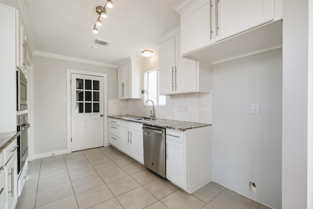 1326 Forest Home Dr, Houston, TX 77077 - kitchen featuring stainless steel appliances, light stone counters, a sink, tasteful backsplash, and white cabinets