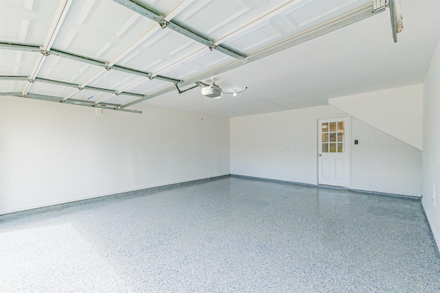 1326 Forest Home Dr, Houston, TX 77077 - garage featuring a garage door opener and baseboards