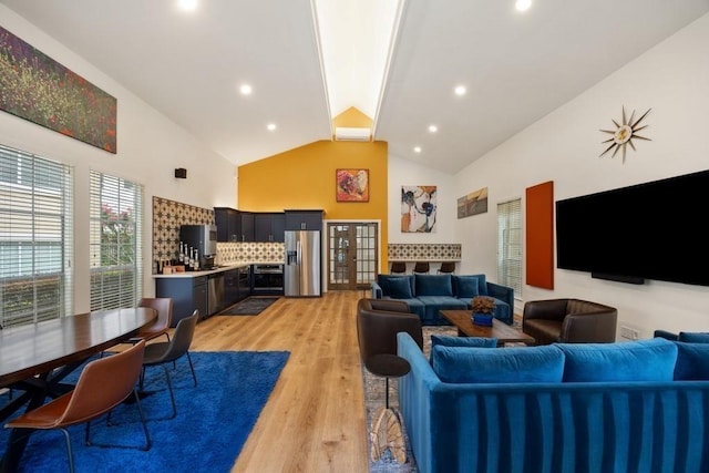 3231 Allen Pkwy Unit 4307, Houston, TX 77019 - living area featuring light wood finished floors, high vaulted ceiling, and recessed lighting