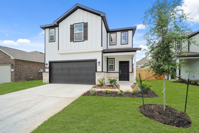 7919 Grand Louis Way, Spring, TX 77379 - view of front of home featuring board and batten siding, stone siding, an attached garage, and driveway