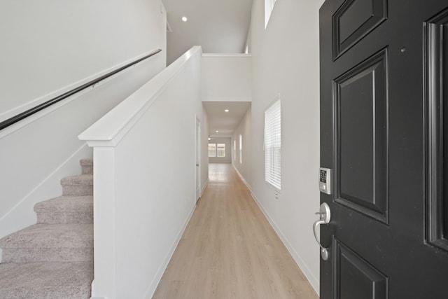 7919 Grand Louis Way, Spring, TX 77379 - foyer entrance with light wood finished floors and a high ceiling