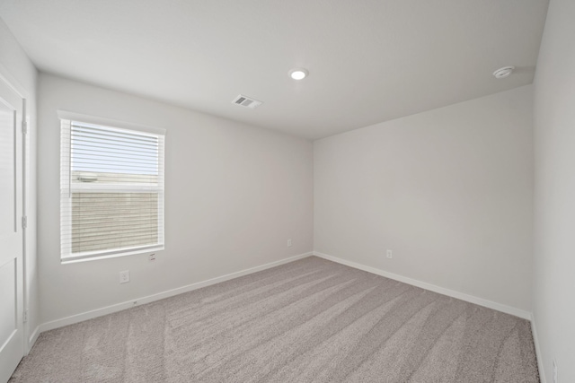 7919 Grand Louis Way, Spring, TX 77379 - carpeted spare room featuring a smoke detector and recessed lighting