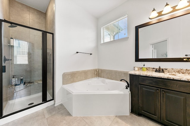 126 Biltmore Loop, Montgomery, TX 77316 - full bathroom featuring a shower stall, vanity, a whirlpool tub, and tile patterned flooring
