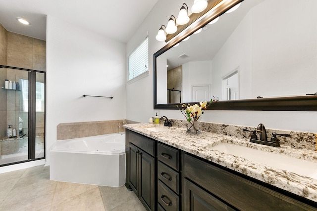 126 Biltmore Loop, Montgomery, TX 77316 - full bath featuring a stall shower, a bath, double vanity, and tile patterned floors