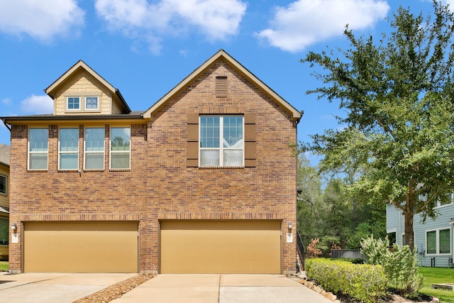 126 Biltmore Loop, Montgomery, TX 77316 - view of front of property featuring a garage, brick siding, and concrete driveway