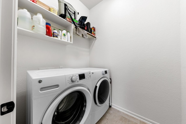 126 Biltmore Loop, Montgomery, TX 77316 - washroom with separate washer and dryer, baseboards, and light tile patterned flooring