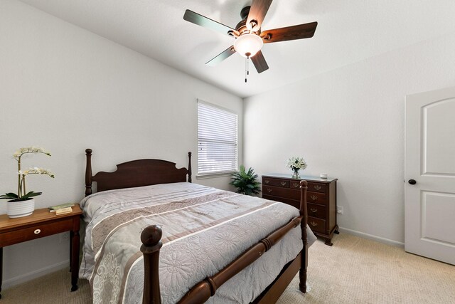126 Biltmore Loop, Montgomery, TX 77316 - bedroom with light colored carpet, a ceiling fan, and baseboards