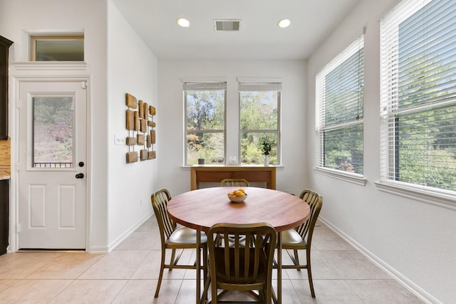 126 Biltmore Loop, Montgomery, TX 77316 - dining area with healthy amount of natural light, light tile patterned floors, recessed lighting, and baseboards