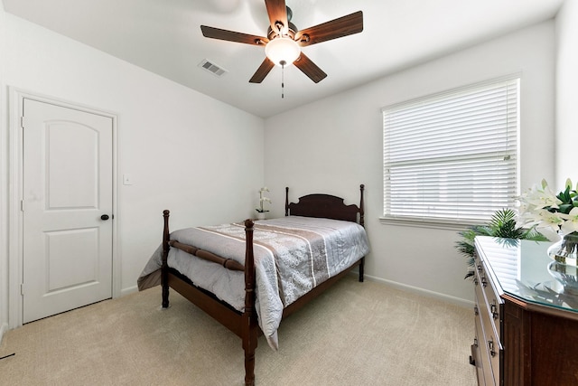 126 Biltmore Loop, Montgomery, TX 77316 - bedroom with light colored carpet, baseboards, and a ceiling fan