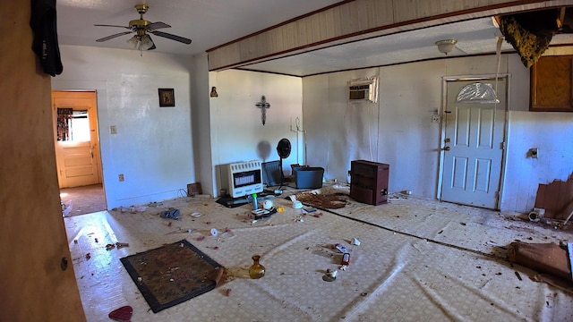 270 S 9th St, Silsbee, TX 77656 - living room featuring a wood stove, ceiling fan, and heating unit