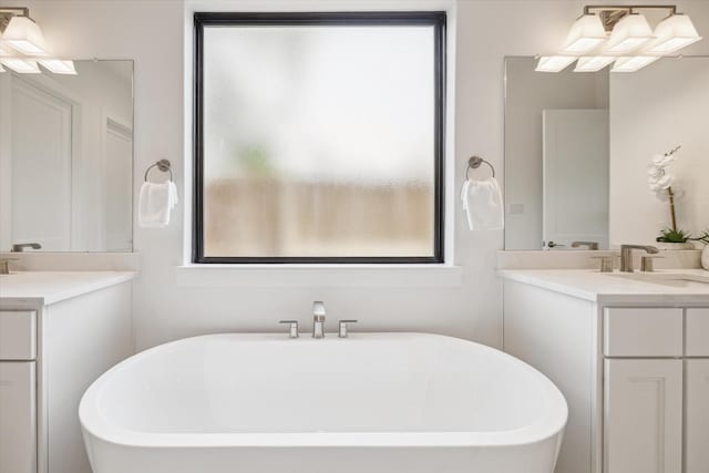 403 Venado View Ct, Conroe, TX 77304 - bathroom with a freestanding tub and two vanities