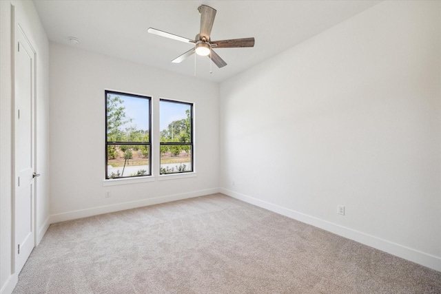 403 Venado View Ct, Conroe, TX 77304 - unfurnished room featuring light carpet, baseboards, and ceiling fan