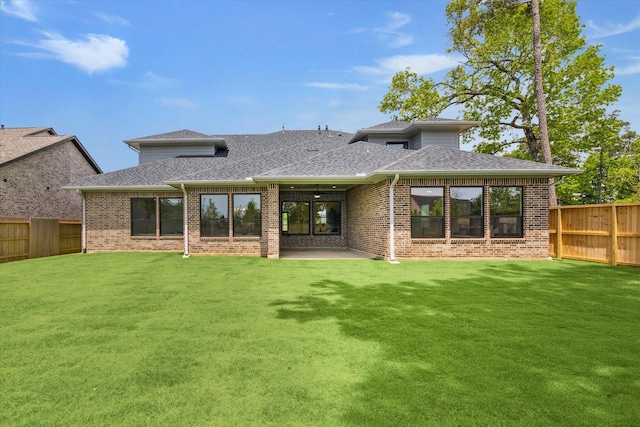 403 Venado View Ct, Conroe, TX 77304 - back of property with a shingled roof, brick siding, and a patio
