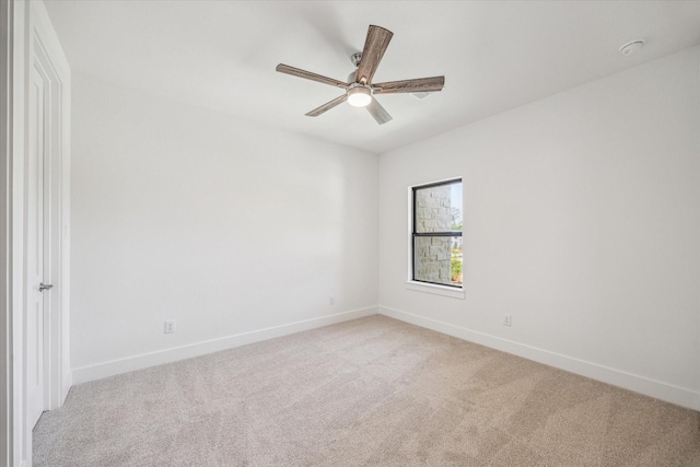 403 Venado View Ct, Conroe, TX 77304 - spare room with light carpet, ceiling fan, and baseboards