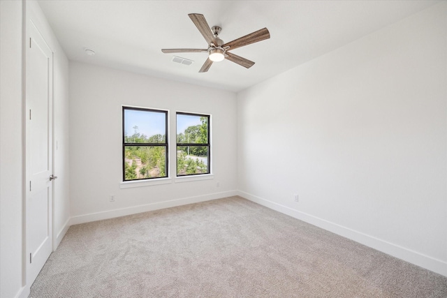 403 Venado View Ct, Conroe, TX 77304 - spare room with light colored carpet, baseboards, and ceiling fan