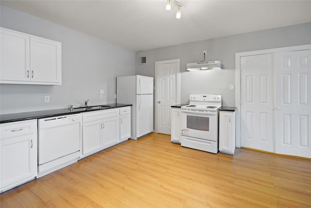 3541 Mount Pleasant St, Houston, TX 77021 - kitchen featuring white appliances, a sink, under cabinet range hood, dark countertops, and white cabinets