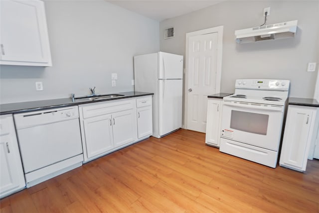 3541 Mount Pleasant St, Houston, TX 77021 - kitchen featuring white appliances, a sink, under cabinet range hood, dark countertops, and white cabinets