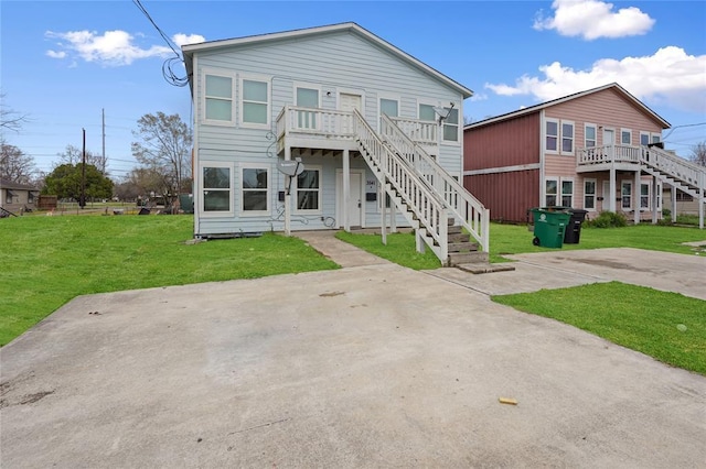 3541 Mount Pleasant St, Houston, TX 77021 - back of house featuring stairway and a lawn