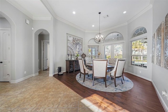 26122 Crown Ranch Blvd, Montgomery, TX 77316 - tiled dining room with arched walkways, baseboards, recessed lighting, a chandelier, and ornamental molding
