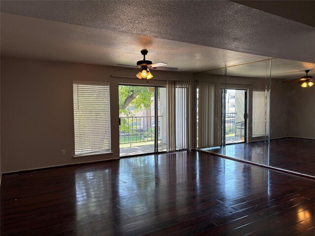 2822 S Bartell Dr Unit 22, Houston, TX 77054 - empty room with ceiling fan, a textured ceiling, wood finished floors, and baseboards