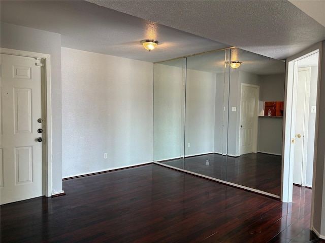 2822 S Bartell Dr Unit 22, Houston, TX 77054 - empty room with wood finished floors and a textured ceiling