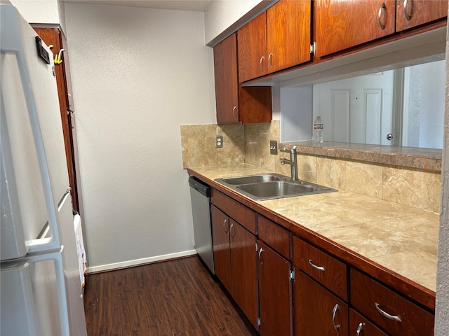2822 S Bartell Dr Unit 22, Houston, TX 77054 - kitchen with a sink, freestanding refrigerator, stainless steel dishwasher, baseboards, and dark wood finished floors