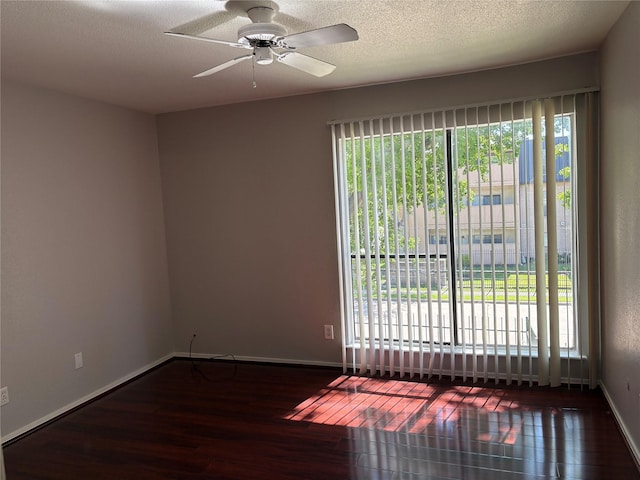 2822 S Bartell Dr Unit 22, Houston, TX 77054 - spare room with wood finished floors, plenty of natural light, baseboards, and a textured ceiling