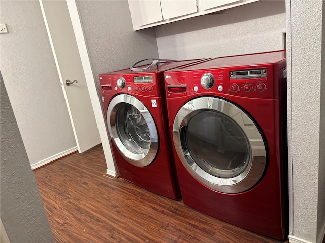 2822 S Bartell Dr Unit 22, Houston, TX 77054 - laundry room featuring independent washer and dryer, wood finished floors, cabinet space, and a textured wall