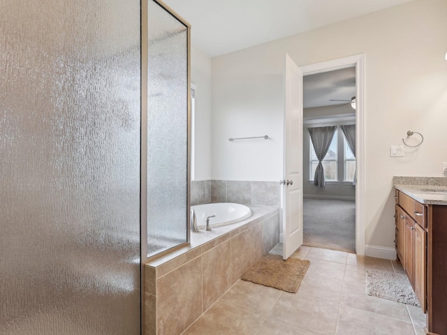 27419 Haywood Ln, Katy, TX 77494 - full bath featuring tile patterned flooring, a shower stall, ceiling fan, vanity, and a garden tub