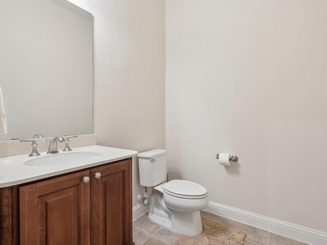 27419 Haywood Ln, Katy, TX 77494 - half bathroom featuring toilet, baseboards, vanity, and tile patterned floors