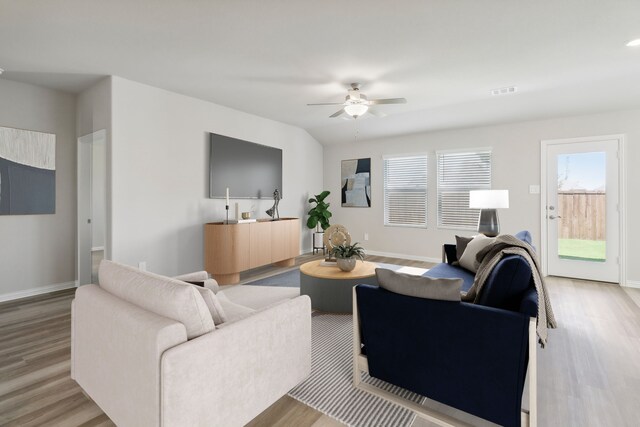 1619 Shae Oak Ln, Conroe, TX 77304 - living area featuring wood finished floors, ceiling fan, and baseboards