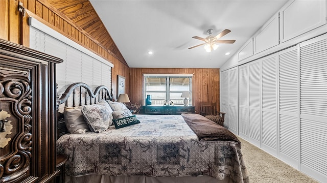 1417 8th St, San Leon, TX 77539 - bedroom featuring lofted ceiling, carpet floors, wood walls, and ceiling fan