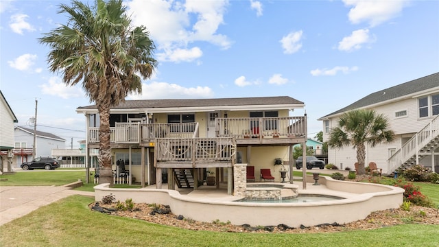 1417 8th St, San Leon, TX 77539 - rear view of house featuring stairs, a yard, and a porch
