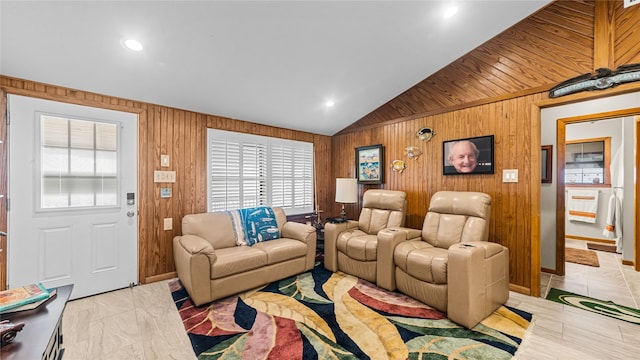 1417 8th St, San Leon, TX 77539 - living area with vaulted ceiling, wooden walls, and light marble finish floors