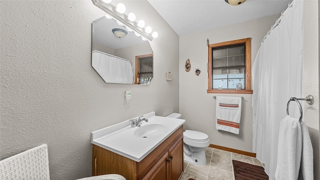 1417 8th St, San Leon, TX 77539 - bathroom featuring vanity, toilet, and baseboards