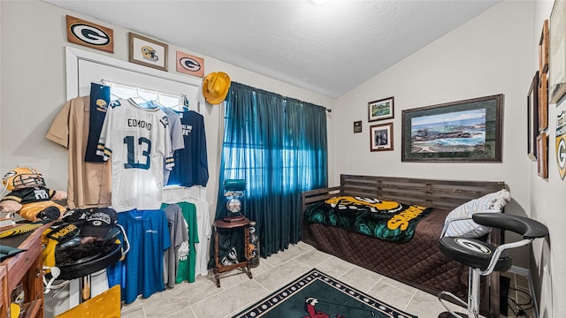 1417 8th St, San Leon, TX 77539 - bedroom featuring vaulted ceiling and a textured ceiling