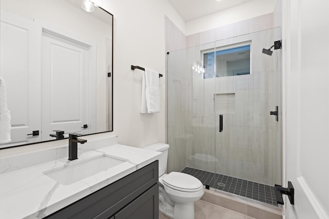6705 Del Rio St, Houston, TX 77021 - bathroom featuring vanity, a stall shower, toilet, and tile patterned floors