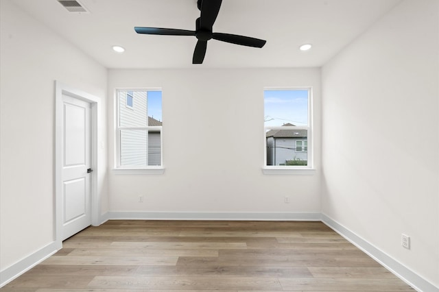 6705 Del Rio St, Houston, TX 77021 - unfurnished bedroom featuring multiple windows, light wood finished floors, baseboards, recessed lighting, and ceiling fan
