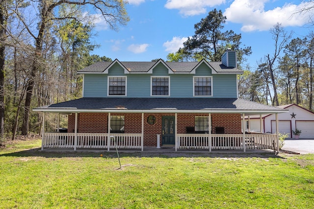 9219 Sendera Dr, Magnolia, TX 77354 - view of front of house featuring covered porch, a chimney, an outbuilding, and a front yard
