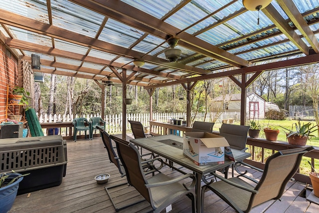 9219 Sendera Dr, Magnolia, TX 77354 - wooden terrace featuring outdoor dining area, a pergola, and an outbuilding