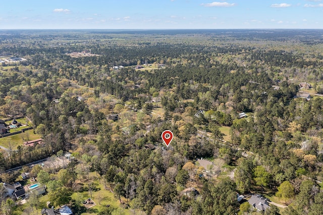 9219 Sendera Dr, Magnolia, TX 77354 - aerial overview of property's location featuring a heavily wooded area