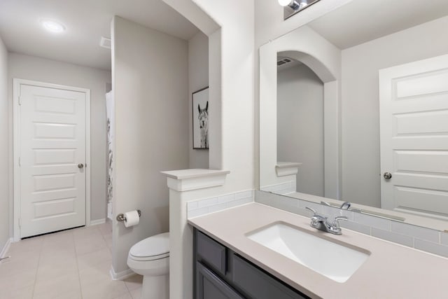17505 Spice Merlot Ln, Conroe, TX 77302 - full bathroom with toilet, vanity, tile patterned flooring, baseboards, and a shower with curtain