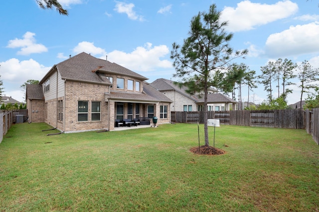 17505 Spice Merlot Ln, Conroe, TX 77302 - back of house with brick siding, roof with shingles, a patio, and central AC unit
