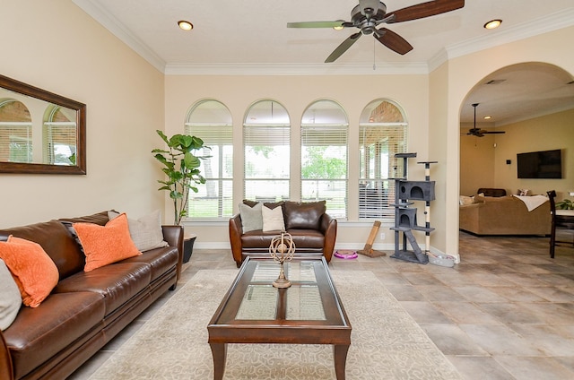 320 Eagle Cv, Hempstead, TX 77445 - living room featuring ceiling fan, crown molding, baseboards, recessed lighting, and arched walkways