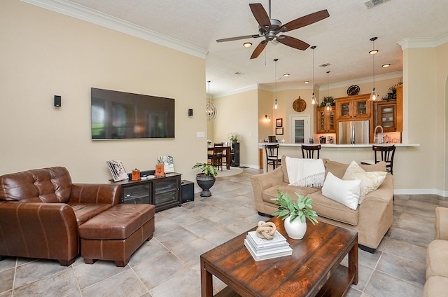 320 Eagle Cv, Hempstead, TX 77445 - living room with a ceiling fan, recessed lighting, baseboards, light tile patterned floors, and ornamental molding