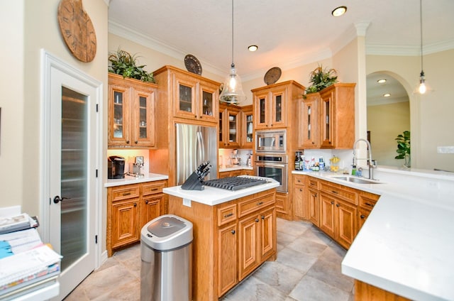 320 Eagle Cv, Hempstead, TX 77445 - kitchen featuring stainless steel appliances, a sink, ornamental molding, light countertops, and arched walkways