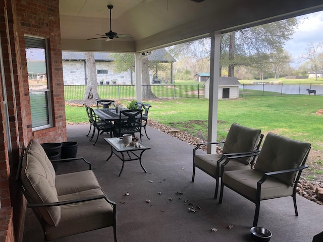 320 Eagle Cv, Hempstead, TX 77445 - view of patio with ceiling fan, a water view, and outdoor dining space