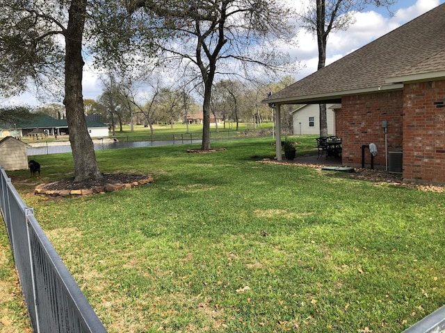 320 Eagle Cv, Hempstead, TX 77445 - view of yard with a water view and a patio