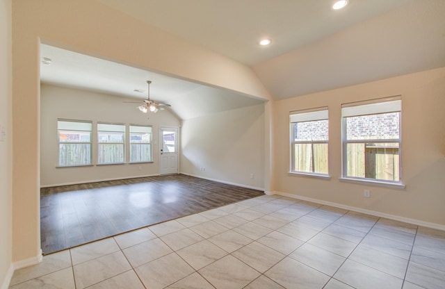 20615 Footstep Path, Katy, TX 77449 - unfurnished room with lofted ceiling, a ceiling fan, light tile patterned flooring, baseboards, and recessed lighting